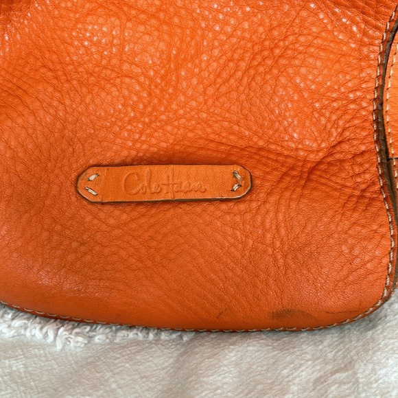 Large leather Cole Haan orange shoulder bag with silver hardware buckles. - Picture 13 of 16